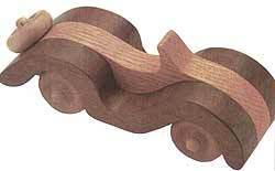 A toy car is made completely out of wood.