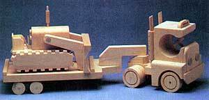 A truck and trailer are completely made out of wood.