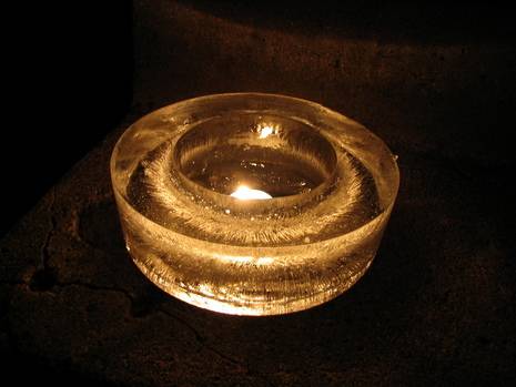 A glowing ring sits on a dark material.
