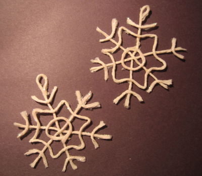 Hanging sparkly snowflake made with jute.