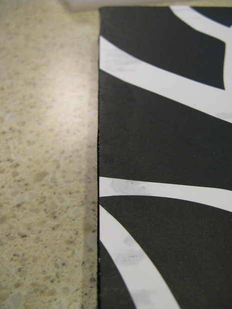 A black and white material on a marble surface.