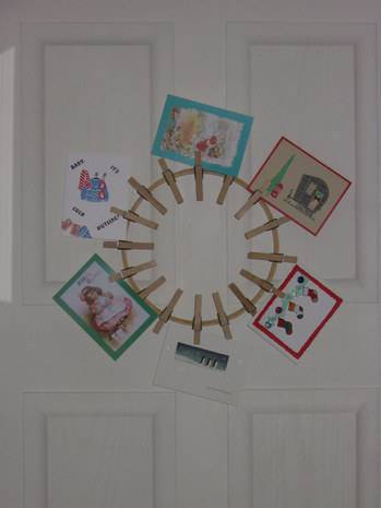 Five cards are displayed on a white door.