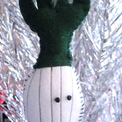 A plush, green and white ornament.