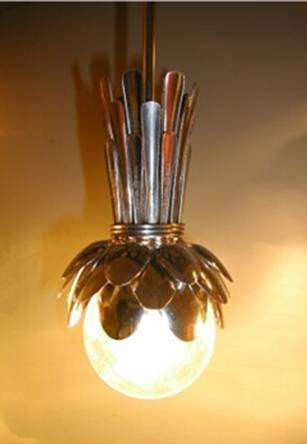 Light made with stainless steel spoons hanging to ceiling.