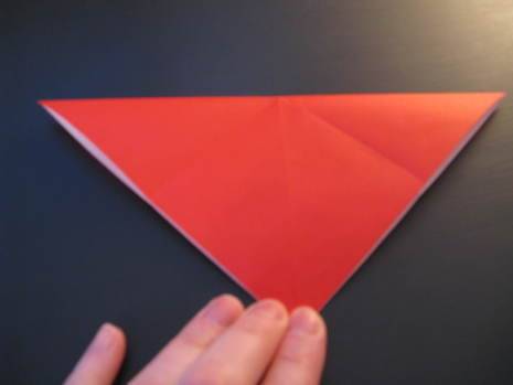 The red color origami paper to make an envelope.