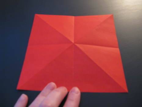 A person explaining how to make origami.