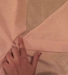 A beautiful hand is holding a silk cloth which is very soft.