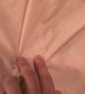 Beautiful fingers holding a soft silk cloth.
