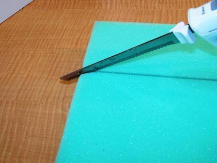 Apply adhesive to one side of the foam and place it on top of the coffee table.