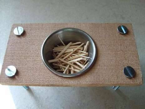 Potato sticks are in a silver pet bowl.