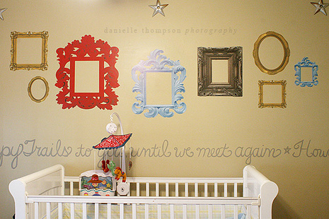 Vinyl photo frames wall decal at the side of the baby bed cot.