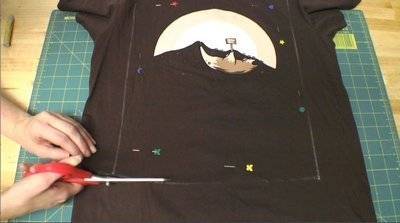 Cutting up a T-shirt.