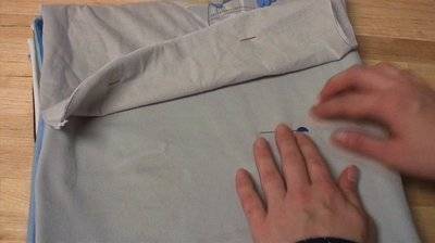 Making a picnic blanket out of T-shirts.