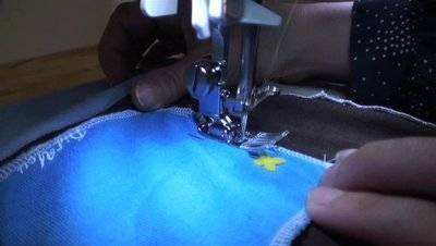 " Sewing  picnic blankets using unused T shirts "