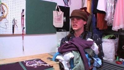 " A lady holding  Picnic Blanket Backpack Out of T-shirts "