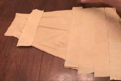 Strips of white fabric placed together as part of a homemade mummy costume.
