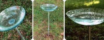 A glass cup sitting in the grass.