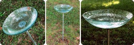A glass cup sitting in the grass.