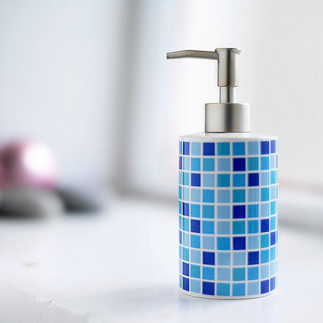 A bottle of soap that looks like it is made up of shower tiles that are blue.