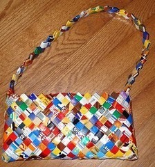 A purse made of cut up potato chip bags that have been woven together.