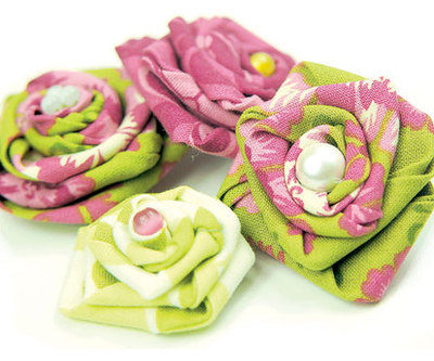 A series of towels or blankets that look to be folded like flowers.