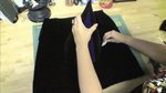 A person working on black fabric.