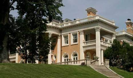 A large mansion with brown and white paint.