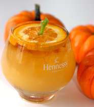 A cognac pumpkin drink in a glass.
