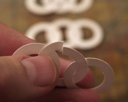 A chain made of small white circles.