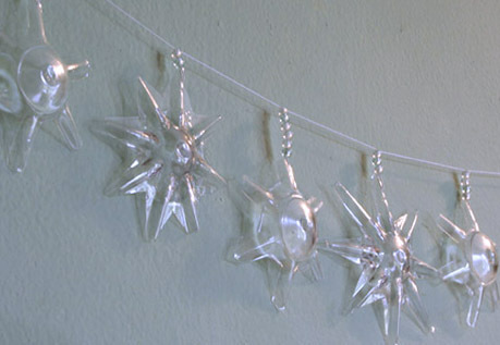 Glass ornaments or lights that look like stars and snowflakes.