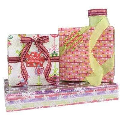 Three boxes are wrapped with gift wrap, one designed to look like Christmas lights, one like Christmas tree ornaments, and one like snowflakes.