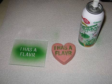 Edible green spray paint, and a painted message on a cookie.