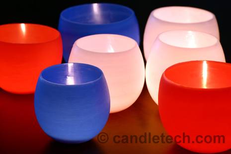 Several colorful cup shaped candles.