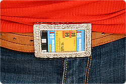 A belt buckle with many bright colors.