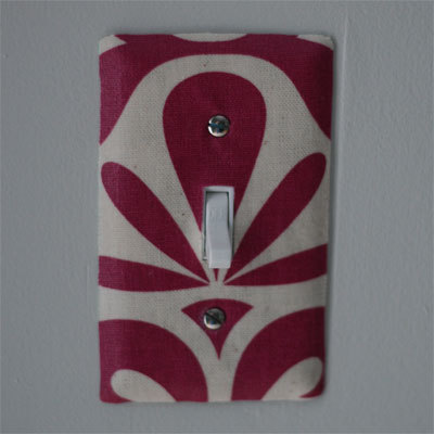 A unique red and white light switch cover.