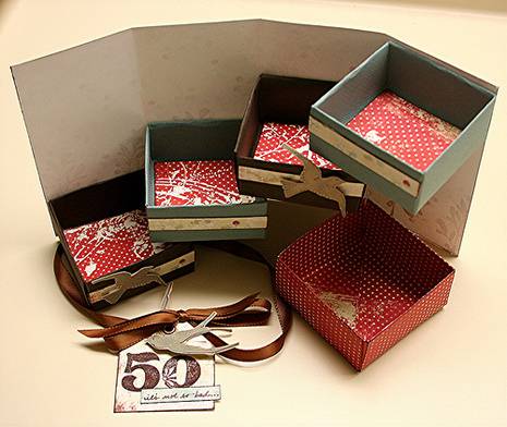 An array of empty square gift boxes with ribbons and a tag that says "50"