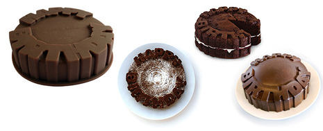 Four chocolate cakes have different designs on them.