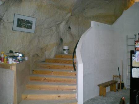 Basement of a home with walls made of stone.