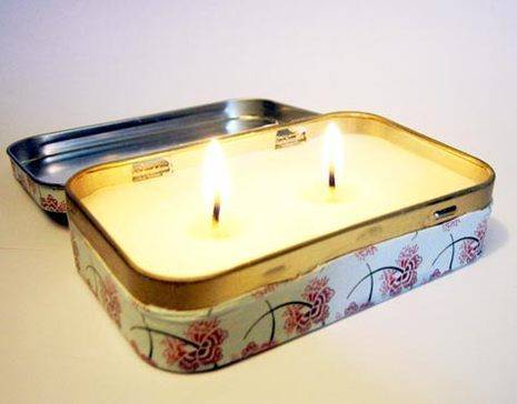 A tin can with a two-wick candle in it