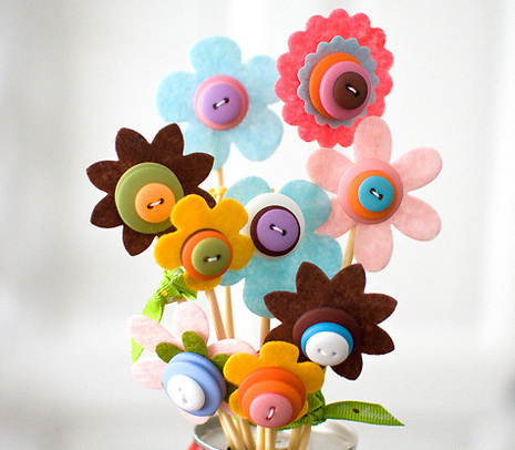 A button bouquet made up of nine button flowers.