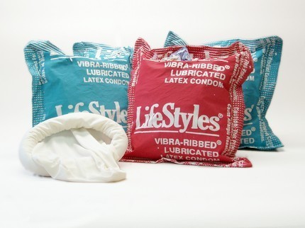 Hand silkscreened giant condom pillow with giant fabric condom