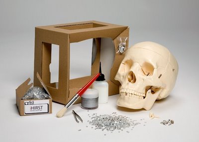 A skull is on a table near a box and other tools.