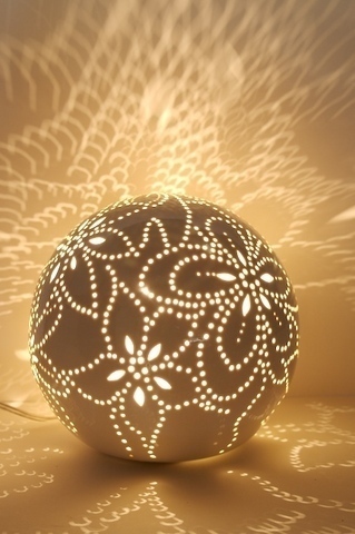 A ball with bright  flower designs that are also lights.