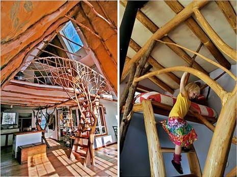 A child is playing in a roof nook that has been made to look like a tree.