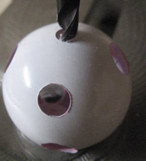 A white ball with many holes through it.