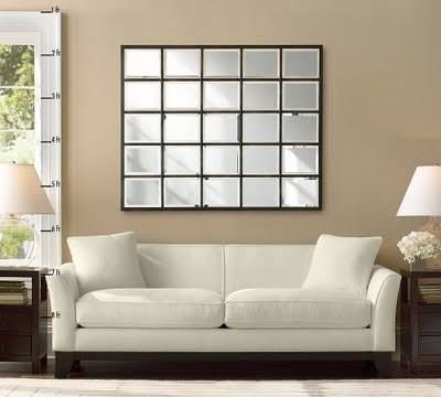 White modern couch with multi panel mirror