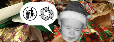 Baby making a face at the huge amount of wrapping paper on the ground.