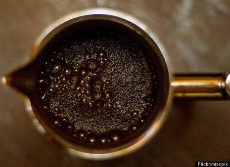 Boiling hot black coffee in a mug.