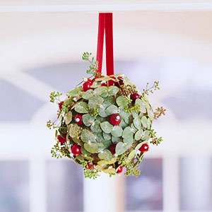 Ornament made from different types of leaves and berries.