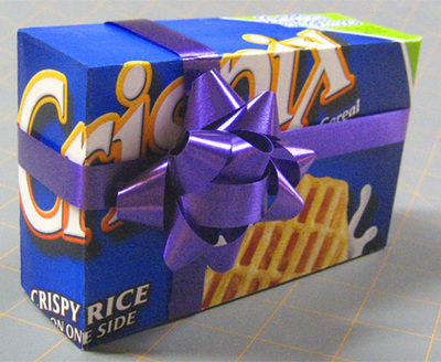 A box of cereal wrapped with a purple bow.